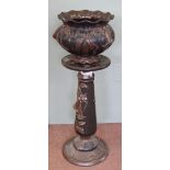 A Bretby black and chocolate glazed floral jardiniere on stand (stand repaired)