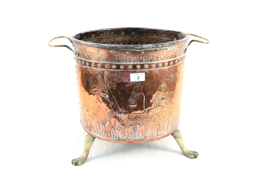 A 19th Century Dutch copper and brass log bin with cottage and woman decoration