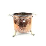 A 19th Century Dutch copper and brass log bin with cottage and woman decoration