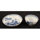 A Lowestoft chinoiserie landscape tea bowl and saucer (light rim chip to bowl,