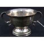 A beaten silver two handled bowl, London 1911 with inscription,