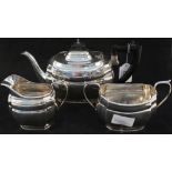 A silver three piece tea set,