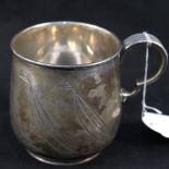 A silver mug with chased yacht designs, J.E.R.N.