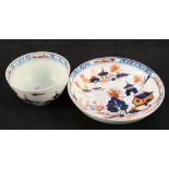 A Lowestoft Redgrave House pattern tea bowl and saucer (light body cracks to saucer)