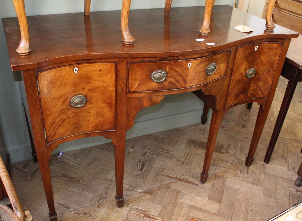 An early 19th Century serpentine front sideboard