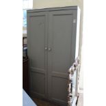A grey painted 19th Century pine two door cupboard