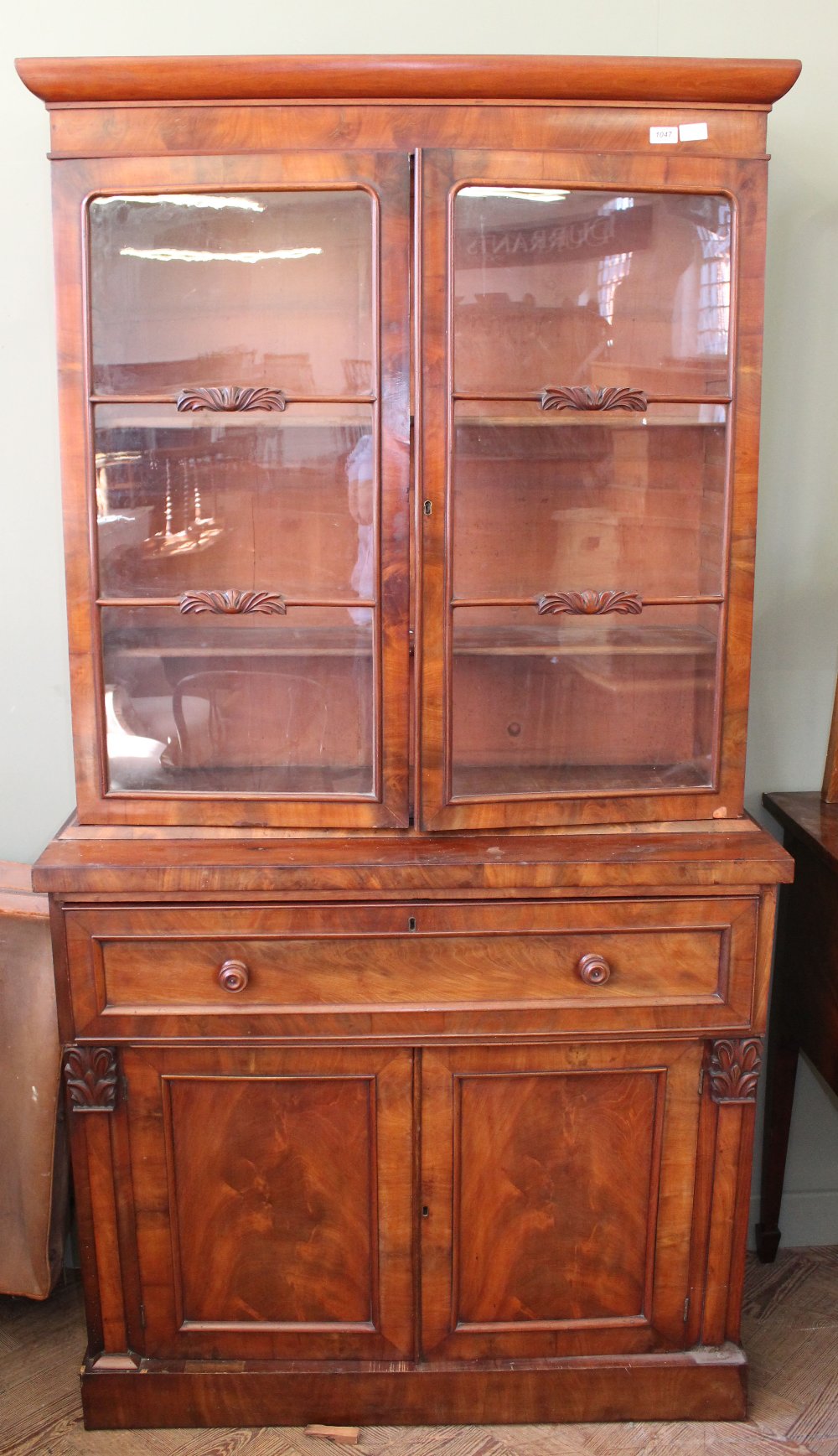 A Victorian mahogany glazed secretaire bookcase with fitted interior