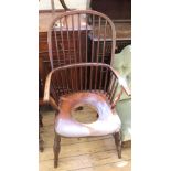 A Victorian comb back elbow chair converted to commode