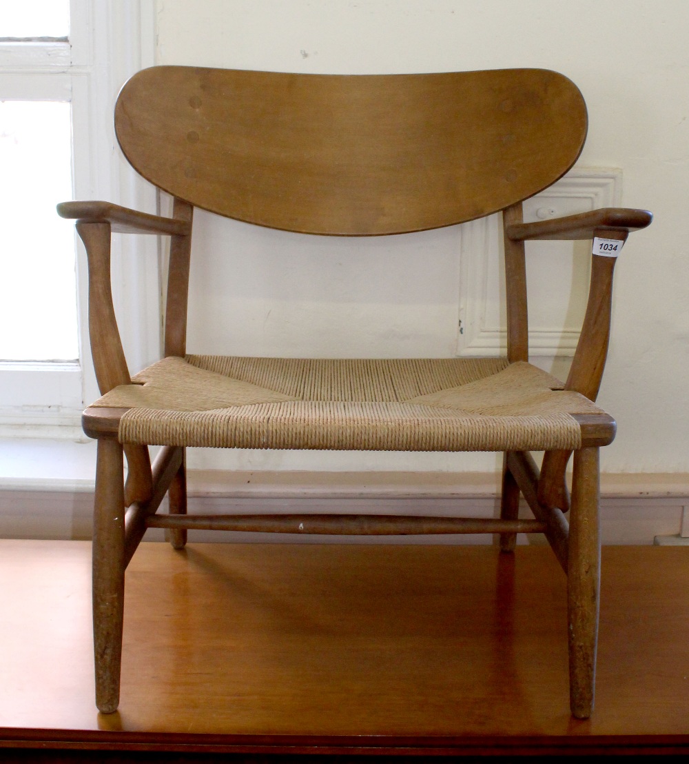 A single lounge chair made by Danish furniture maker Carl Hansen & Sons designed by Hans Wegner,