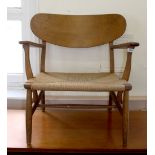 A single lounge chair made by Danish furniture maker Carl Hansen & Sons designed by Hans Wegner,