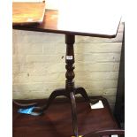 A Victorian mahogany rectangle top tripod table