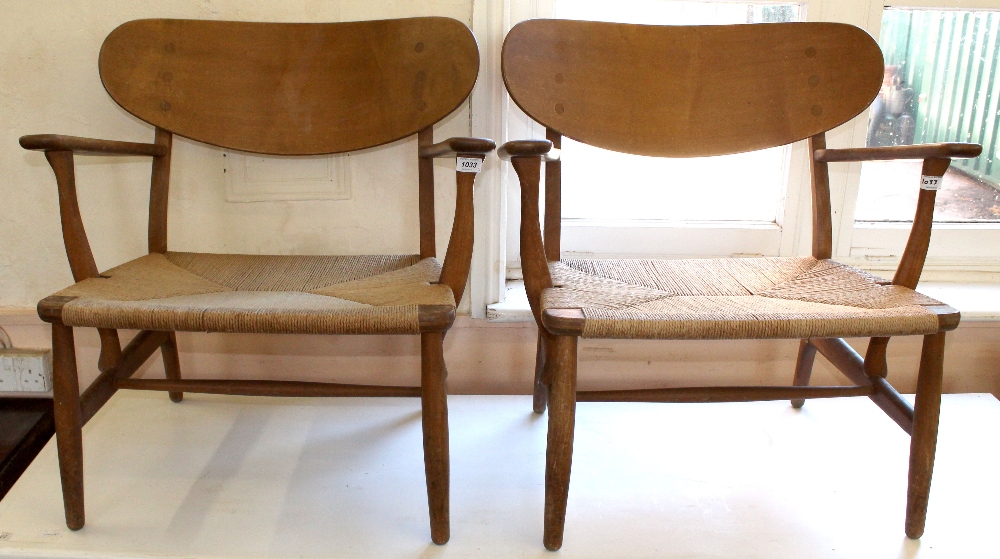 A pair of lounge chairs made by Danish furniture maker Carl Hansen & Sons, designed by Hans Wegner,