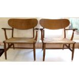 A pair of lounge chairs made by Danish furniture maker Carl Hansen & Sons, designed by Hans Wegner,