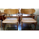 A pair of lounge chairs made by Danish furniture maker Carl Hansen & Sons, designed by Hans Wegner,