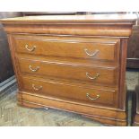 A reproduction chest of four drawers