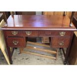 A four drawer mahogany writing desk