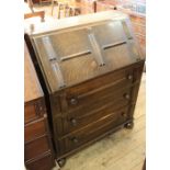 A 1920's oak bureau with fitted interior