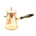 A large 19th Century copper coffee or chocolate pot with ebonised wood side handle