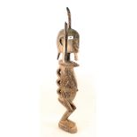 A large West African stylised standing figure,