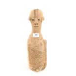 An African pottery figure of elongated form,