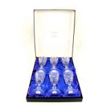 A boxed set of six Mappin & Webb cut wine glasses plus a part canteen of cutlery