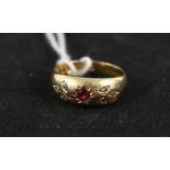 An 18ct gold garnet set ring,