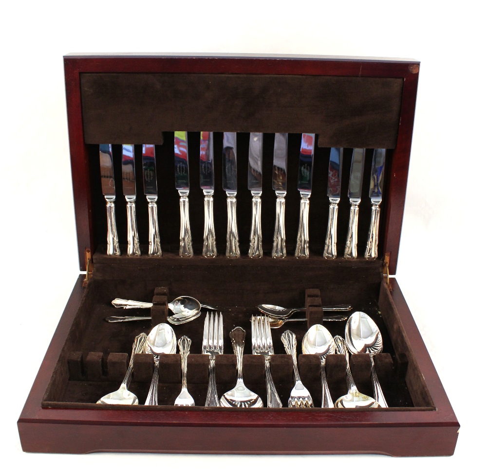 A mahogany canteen of Sheffield silver plated cutlery plus an oak canteen