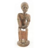 A possibly Madagascan seated woman and child,