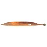 An aboriginal woomera with hook and resin grip,