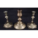 An early 18th Century seamed brass candlestick with domed base,