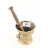 A small continental bronze mortar with text to rim 'LOF GODT VAN AL AO 1528',