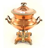 A Regency copper and brass samovar with milk glass handles