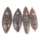 Four Pacific hardwood wall masks