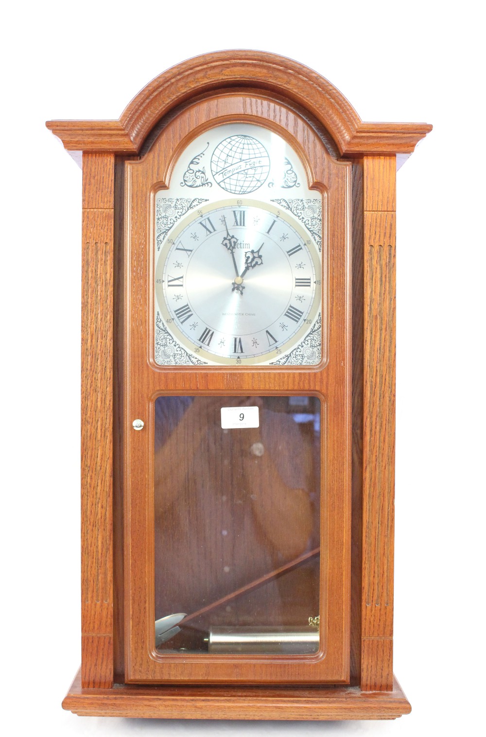 An oak cased Acctim Westminster chime wall clock