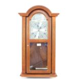 An oak cased Acctim Westminster chime wall clock