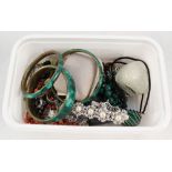 A box of various costume jewellery including malachite bangles and a garnet cameo