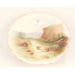 A Limoges wall plate with painted rural scene decoration