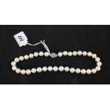 A beautiful pearl necklace with large uniform pearls with lovely diamond set white gold clasp