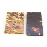 A tortoiseshell card case plus an advertising note pad