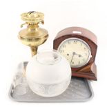 An inlaid mahogany mantel clock plus a brass oil lamp