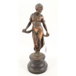 A bronze of a standing lady,