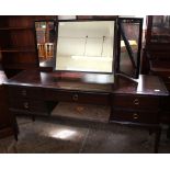 A Stag dressing table with five drawers and triple mirror