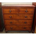 A Victorian mahogany chest of five drawers with turned feet and mother of pearl inlaid handles
