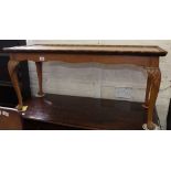 A carved oak cabriole leg coffee table