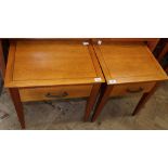 A pair of modern bedside tables with single drawers