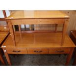 A modern three drawer writing desk and a coffee table