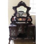 A large Victorian ornately carved shelf and mirror back sideboard with bow fronted glazed cupboard