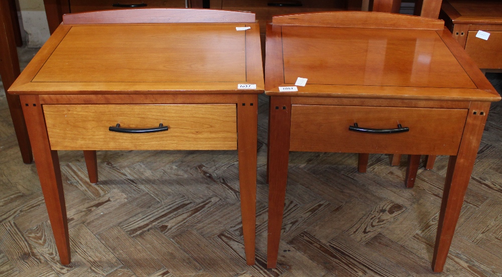 A pair of modern bedside tables with single drawers