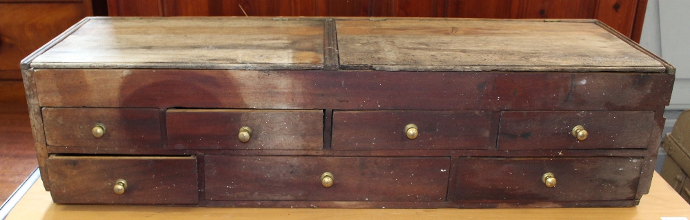 A small pine bank of seven drawers