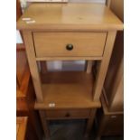 A pair of faux pine bedside table with single drawer